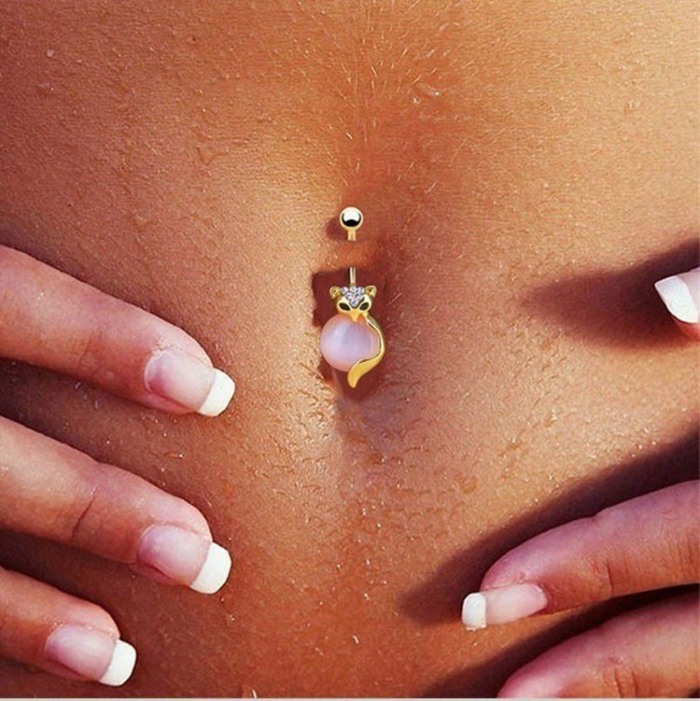 Piercing al melic: foto com es fa, es cura. Pírcing d'or, plata